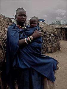 A Maasai woman and her child in a village in Tanzania. A Maasai woman and her child in a village in Tanzania.
